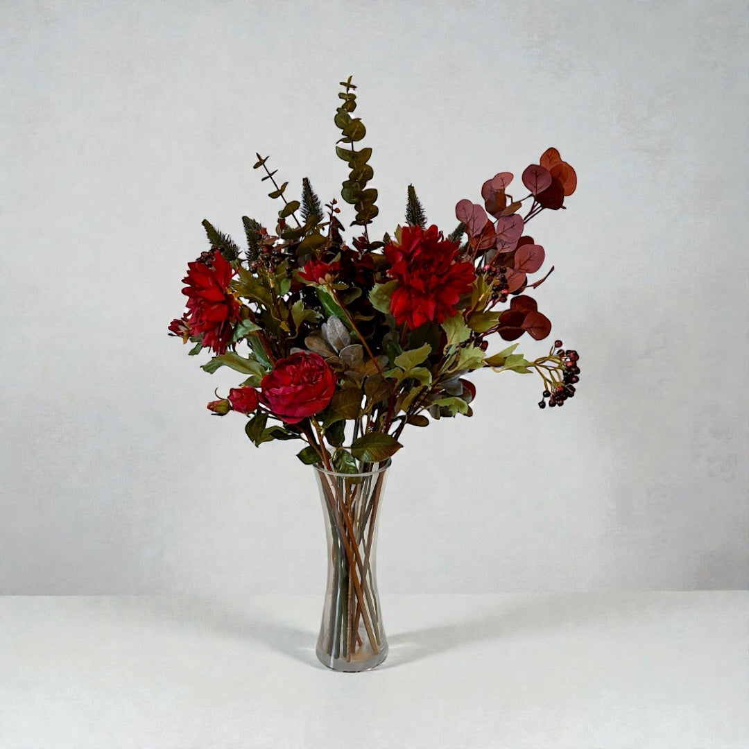 Premium silk flower bouquet showing highly realistic roses and carnations in a glass vase by elm and willow