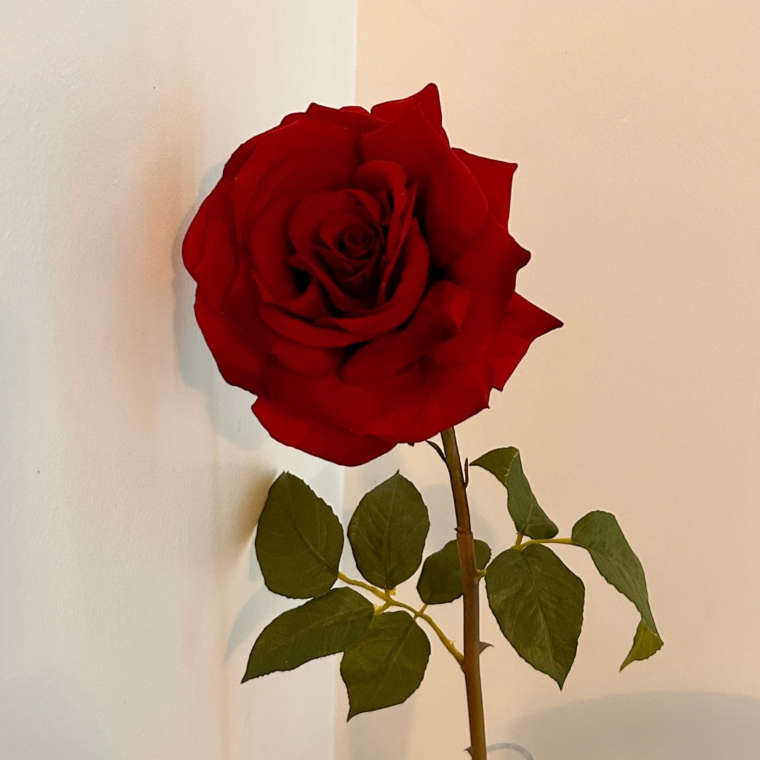 Close up of a single stem. highly realistic red silk rose by Elm and Willow.