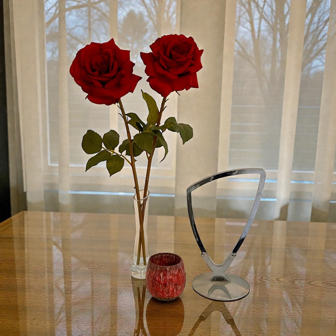 Two single stem silk red roses in a glass vase showcasing highly realistic artificial flowers by elm and willow
